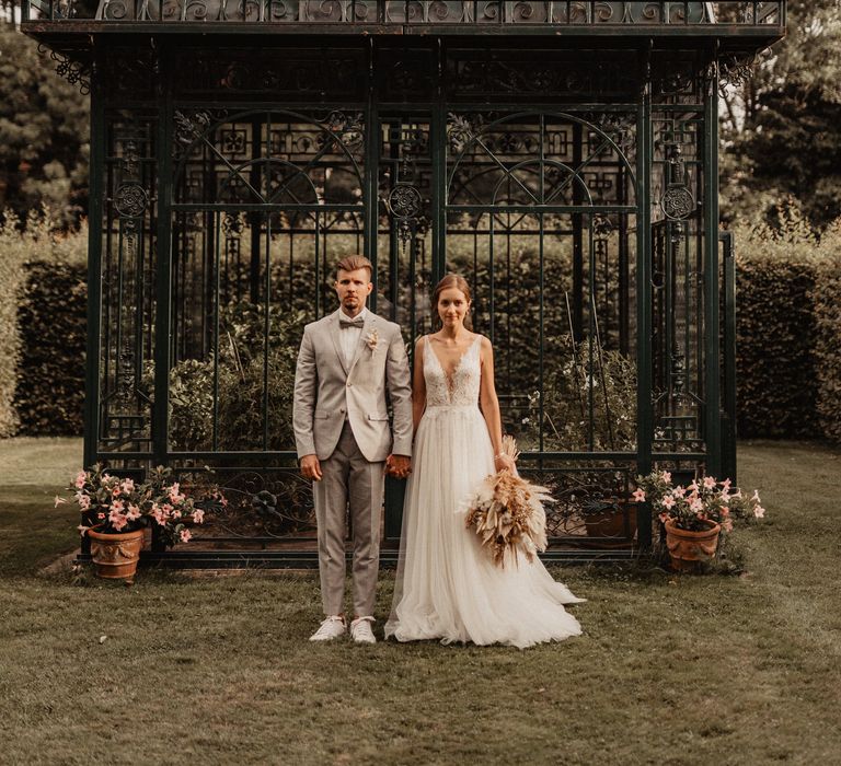 Bride and Groom in garden of Schloss von Hammerstein 