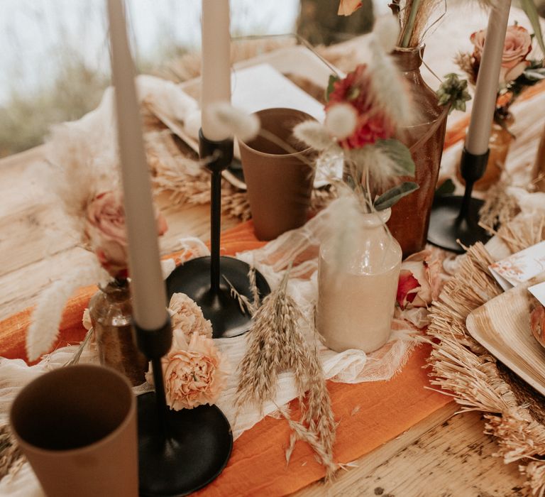 Table decor with black candlestick holders 