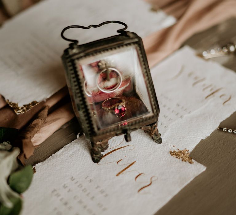 Ruby ring in a gold glass ring box 