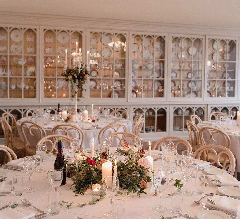 White table décor with accents of red and berry at Brympton House 