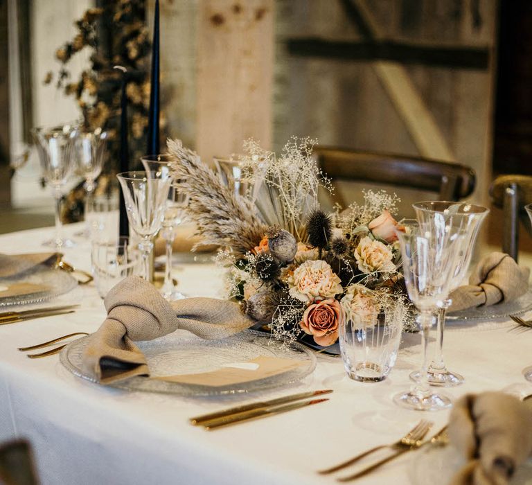 Neutral toned tablescape with floral centrepiece for rustic luxe wedding ideas