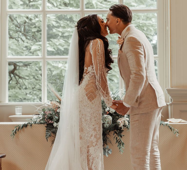 Bride & groom kiss on their wedding day