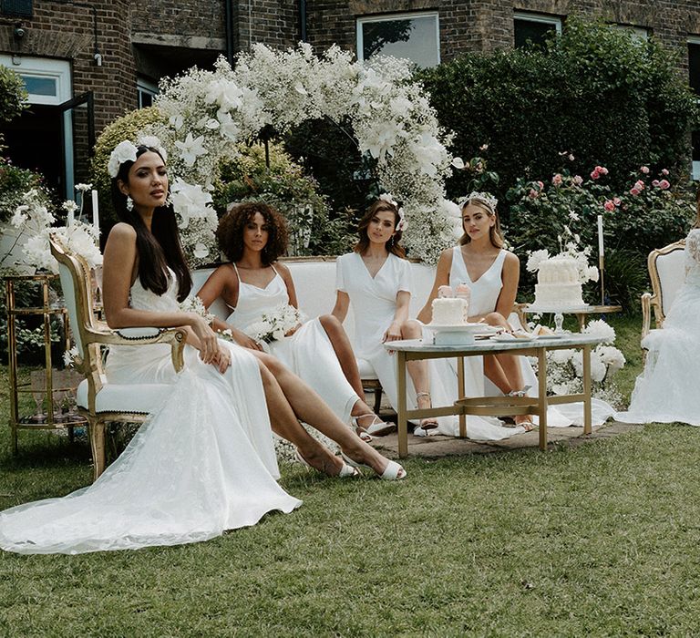 Tea party at Winchester Club in Putney with brides in Constellation Ame wedding dresses 