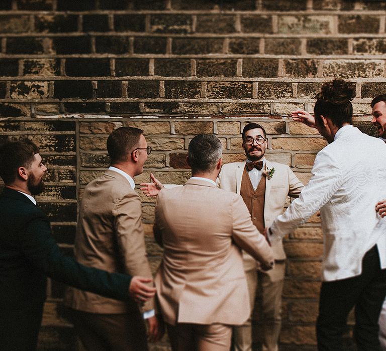 Groom dances with wedding party on the day of his wedding 