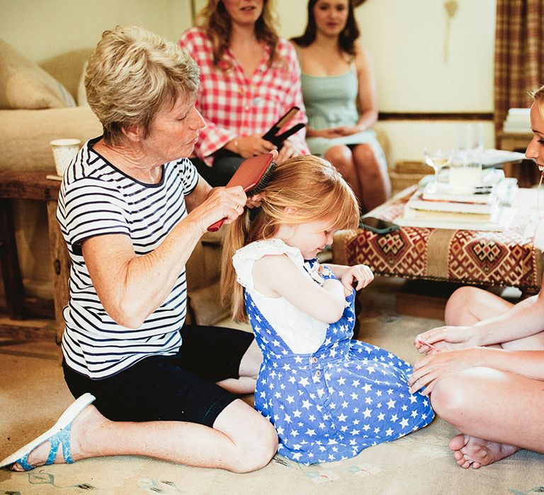 Bridal party gets ready as they do their hair and makeup for the wedding day 