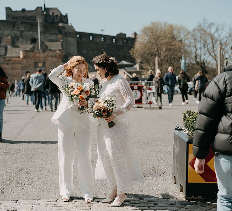 Brides stand outdoors in Edinburgh for relaxed and intimate wedding 