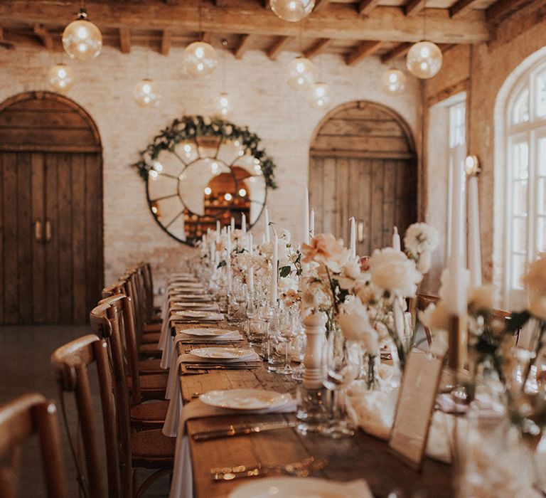 Rustic Iscoyd Park wedding venue wedding breakfast with romantic lighting and pink and white flowers