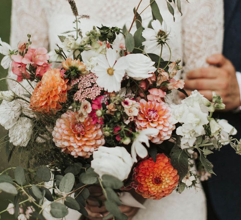 Coral, peach and white wedding bouquet with cosmos, dahlias and roses 