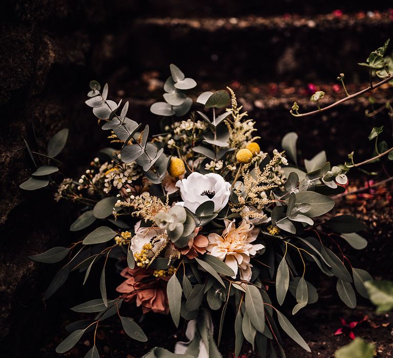 Pink, white and yellow wedding bouquet with eucalyptus leaves 