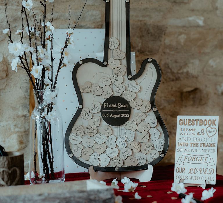 Alternative wedding guest book idea with a wooden puzzle wooden guitar guest book 