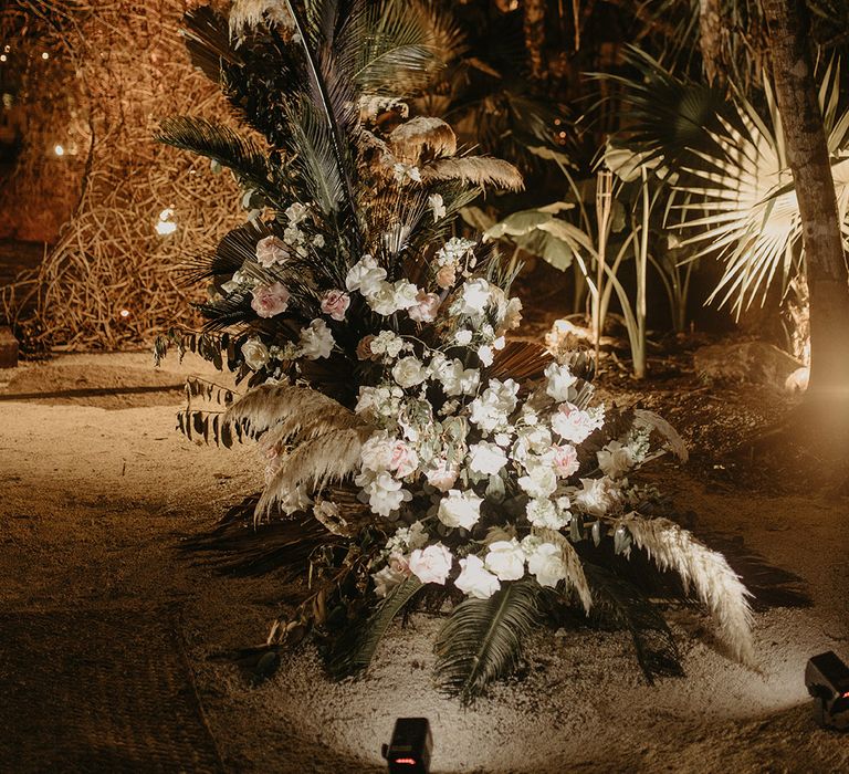 White and pink floral installation complete with green foliage