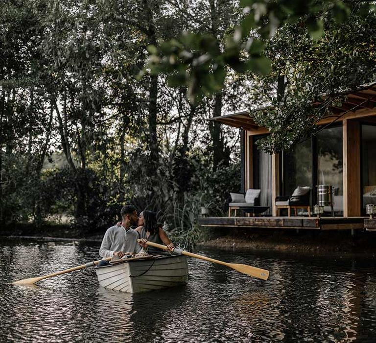 Bride and groom rowing a rowboat in a lake on wedding honeymoon from Prezola, prize in bride to be gift box 