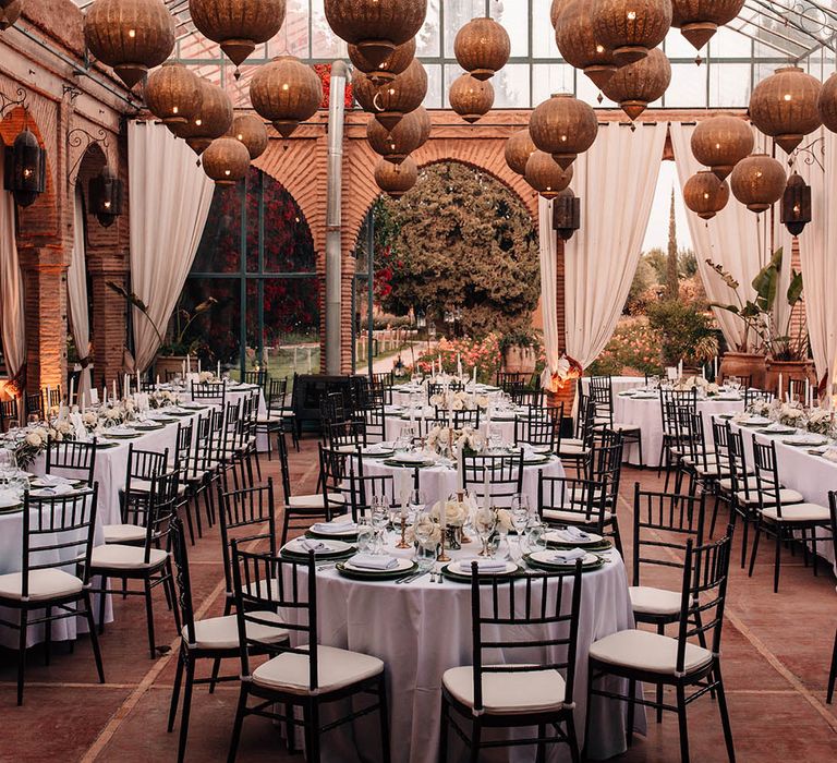 Beldi Country Club wedding venue with golden lanterns and white drapery 