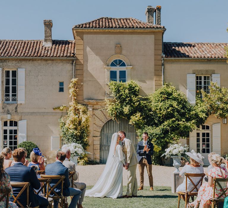 you may now kiss the bride wedding day moment at Château de Malliac