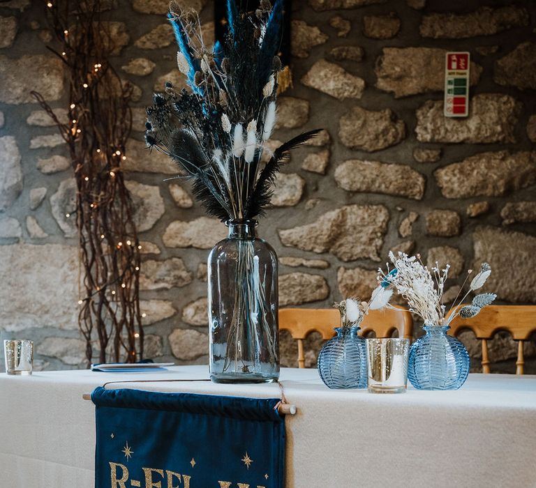 Midnight blue and gold wedding banner sign with blue bunny grass and pampas grass decoration 