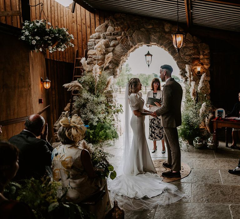 Willow Marsh Farm festival wedding for bride and groom with pampas grass flower arrangements 