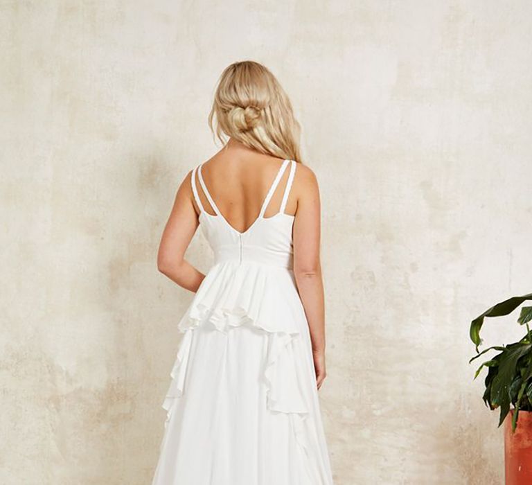 Sustainable strapless wedding dress with waterfall ruffles at the back from Indiebride London in boho style