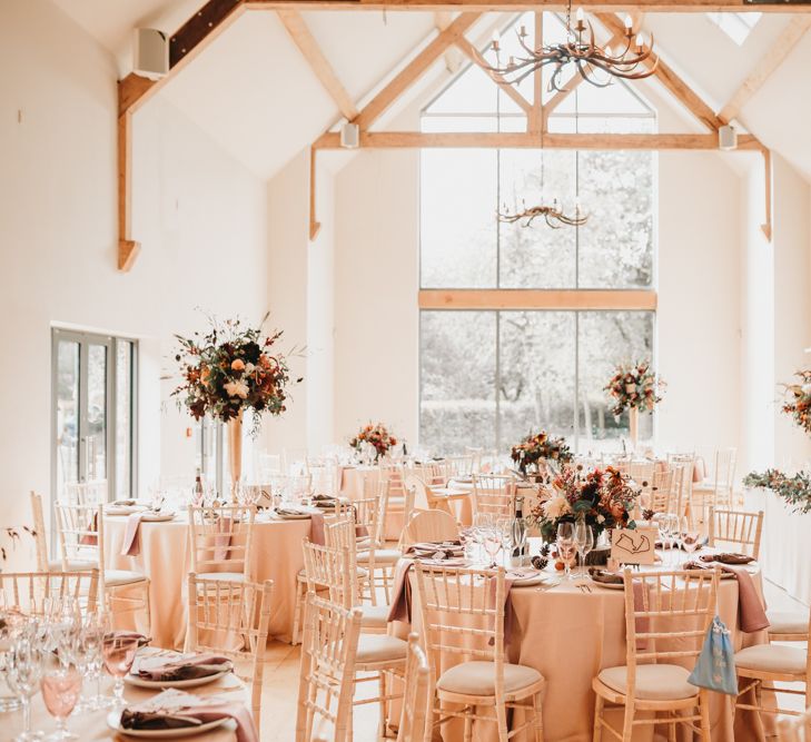 Millbridge Court wedding reception with autumn flowers and rustic decor 