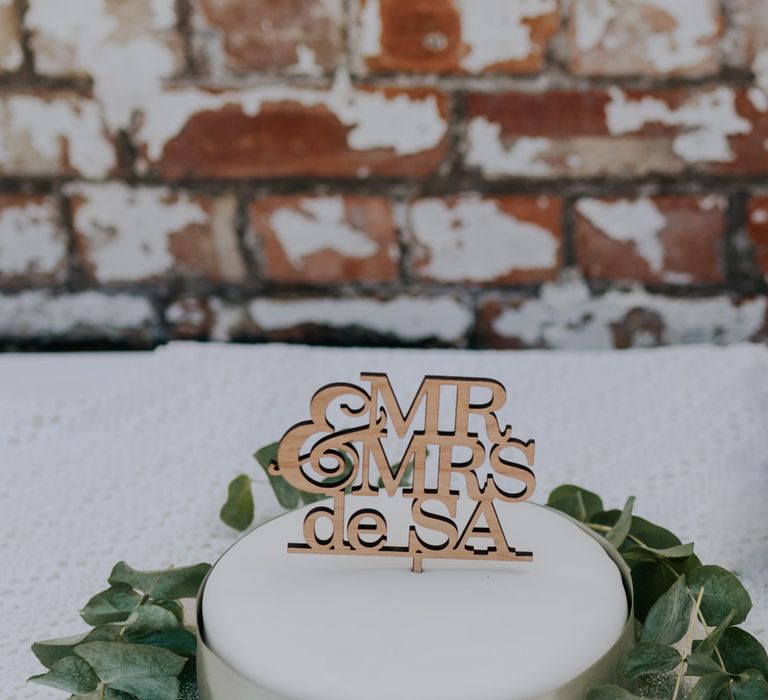 Single tier wedding cake with laser cut cake topper 