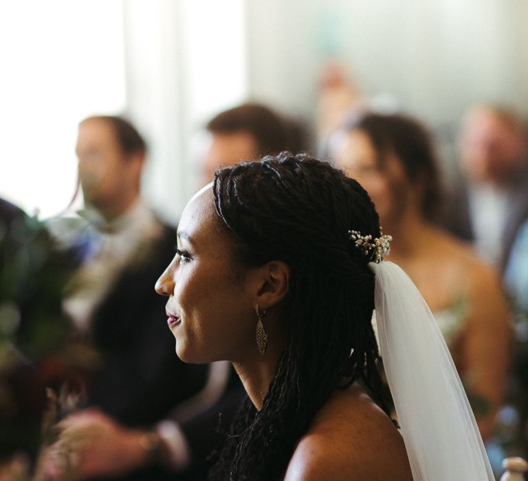 bride with hair up half down hair and wedding veil 