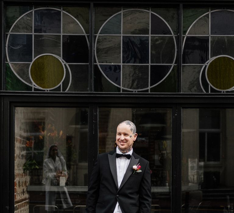 Tattooed groom in tuxedo 