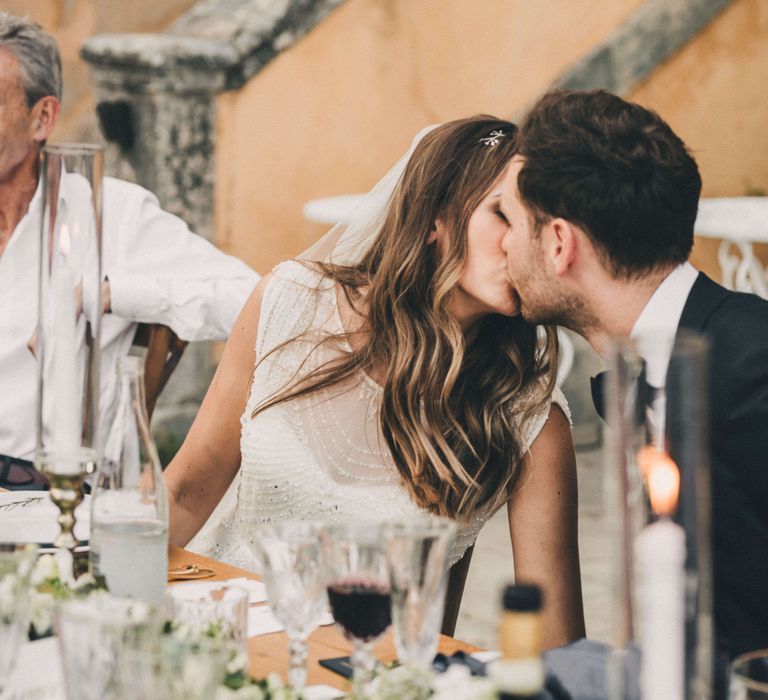 Newly-married Couple kissing at Italian wedding