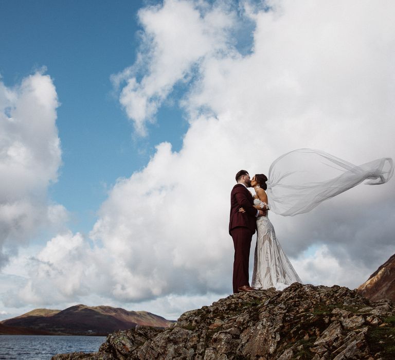 Bride and Groom by lake at a small wedding in the Lake District