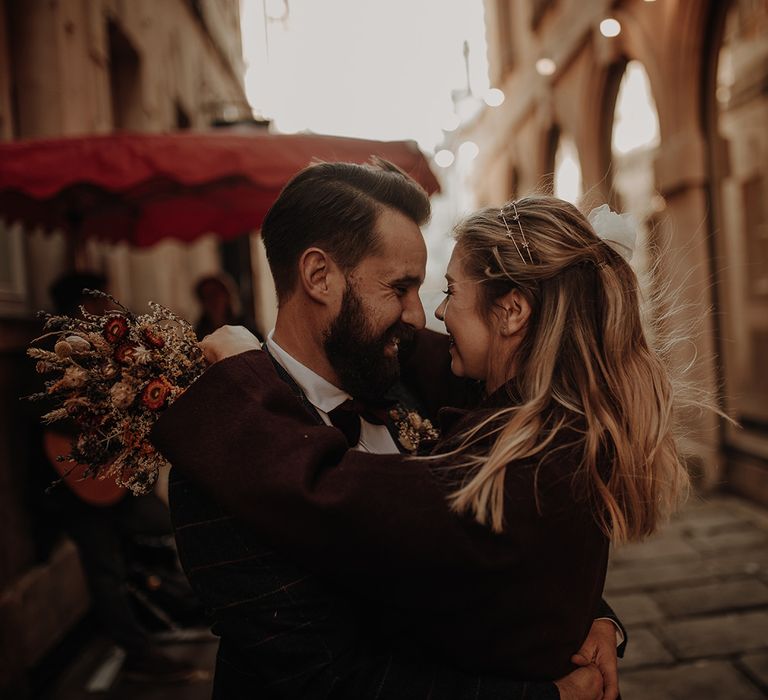 Bride and groom share a moment at city elopement