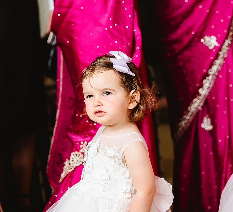 Flower girl in a tulle and appliqué dress 