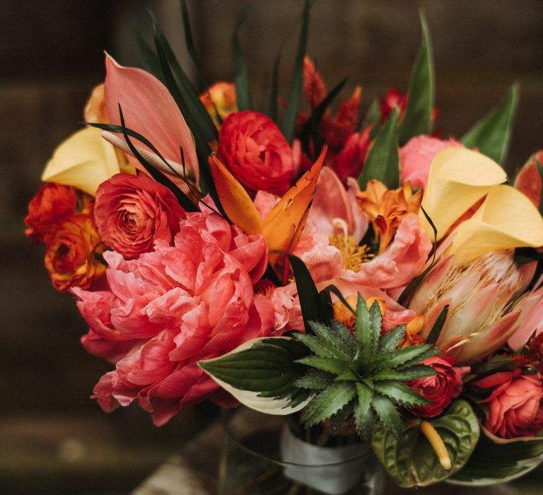 Bright pink and yellow topical wedding bouquet 