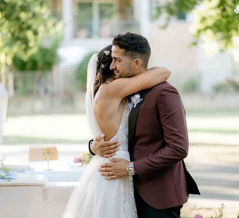 Bride and groom kiss at romantic Italian wedding