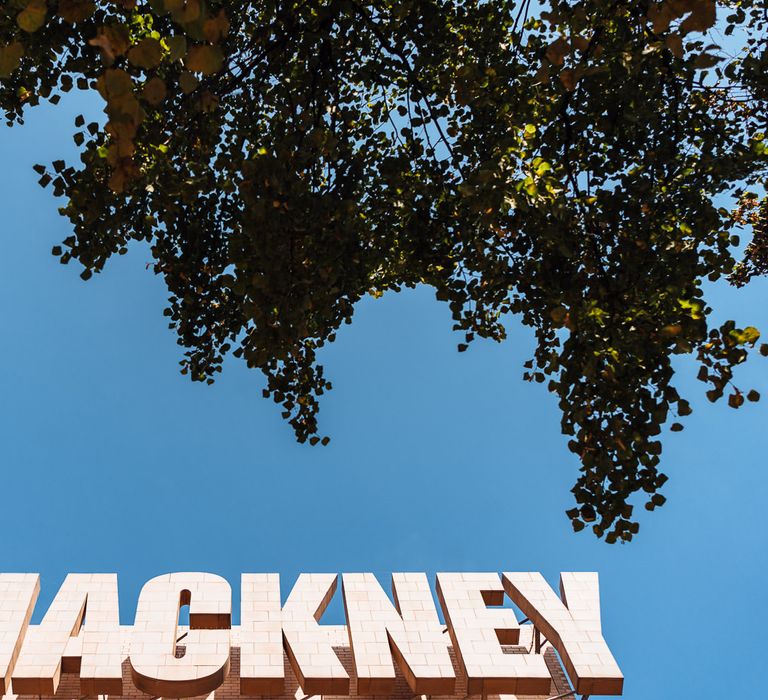 Hackney Town Hall sign with blue sky