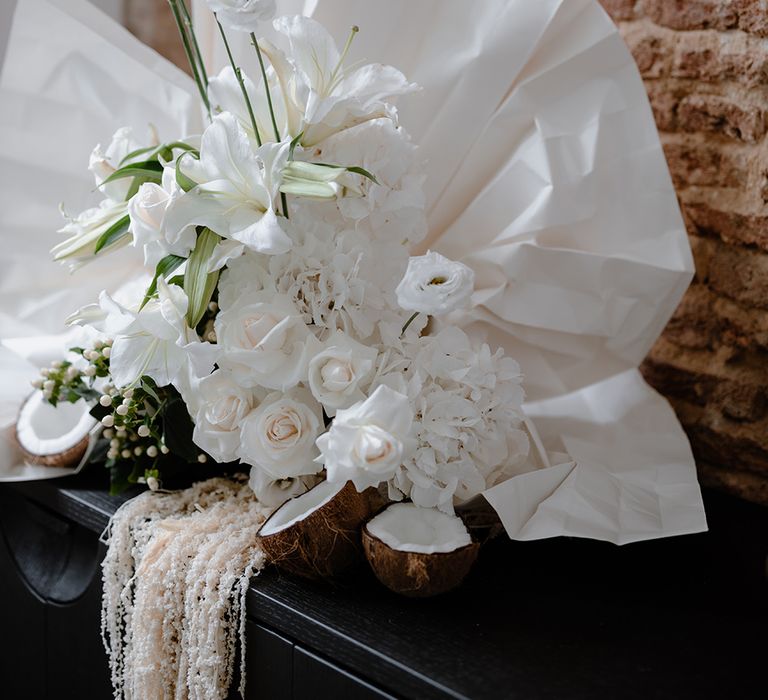 White Lilies, hydrangeas and roses wedding flower and fan arrangement 