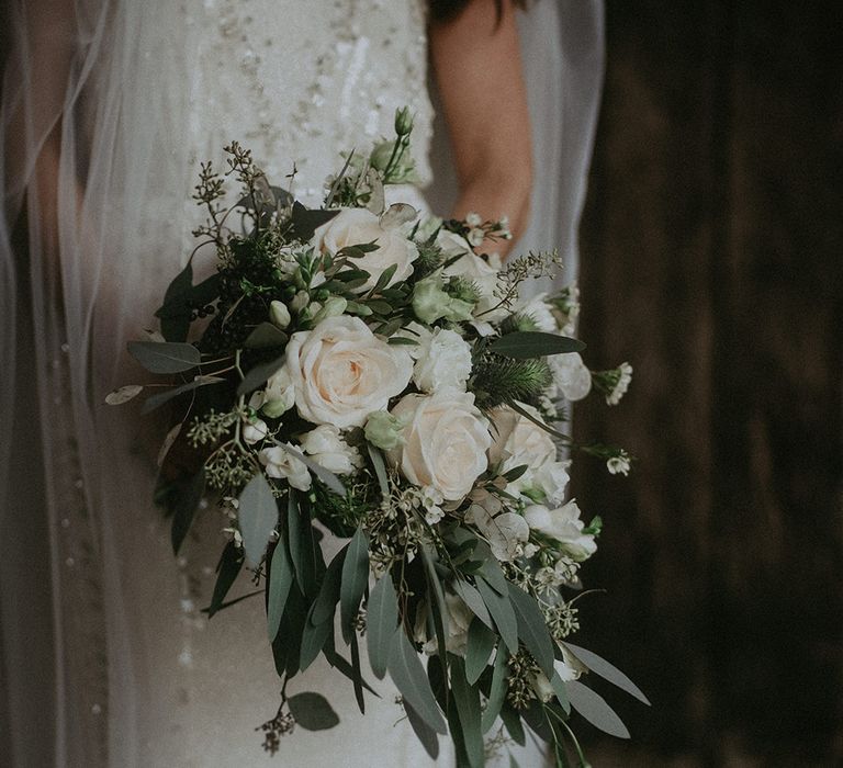 White floral bouquet with green foliage 