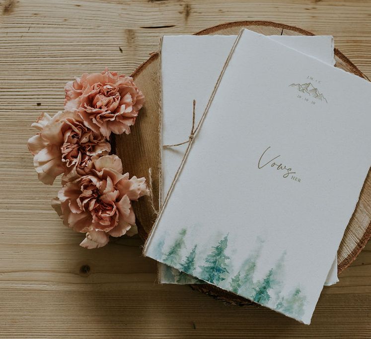 Wedding vow books with green pine tree design 