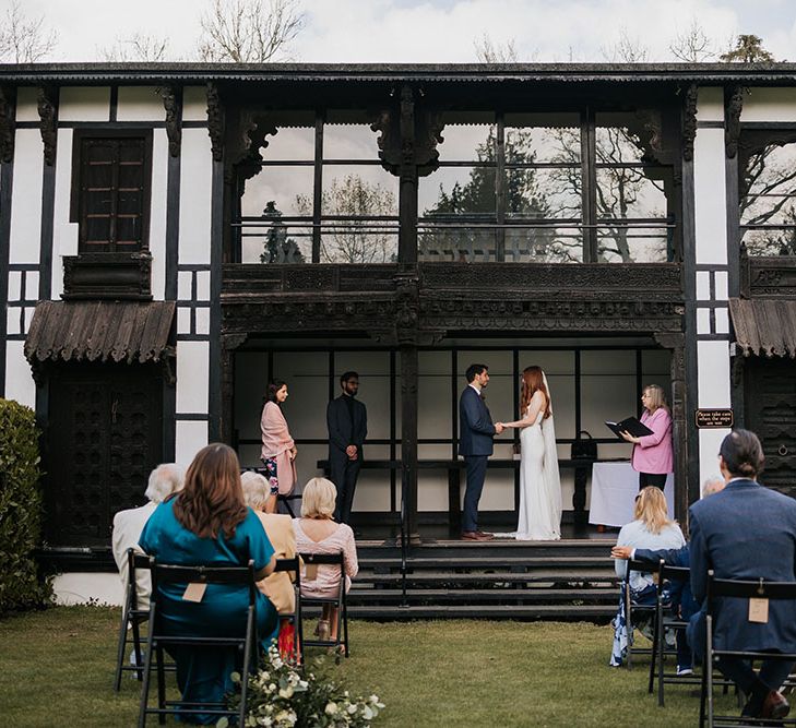 Intimate outdoor wedding ceremony at Larmer Tree Gardens wedding venue in Wiltshire/Dorset 