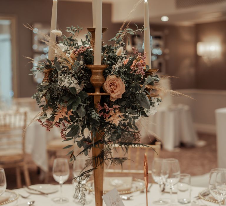 Elegant and classic wedding decor with candlestick holder in gold