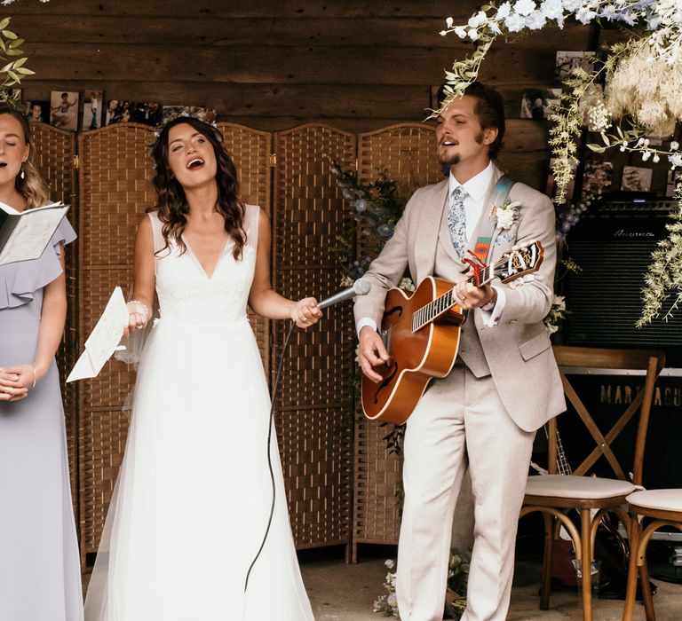 Bride sings with band on the day of her wedding 