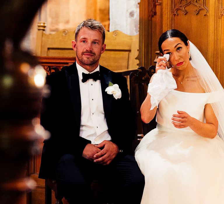 Emotional bride and groom during church wedding ceremony