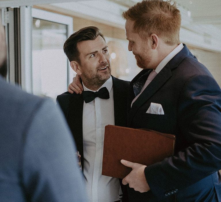 Groom in classic black tuxedo captured by Isle of Wight wedding photographer