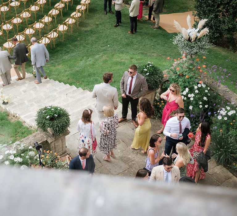 Outdoor summer garden wedding at Georgian home in Bath with colourful flowers 