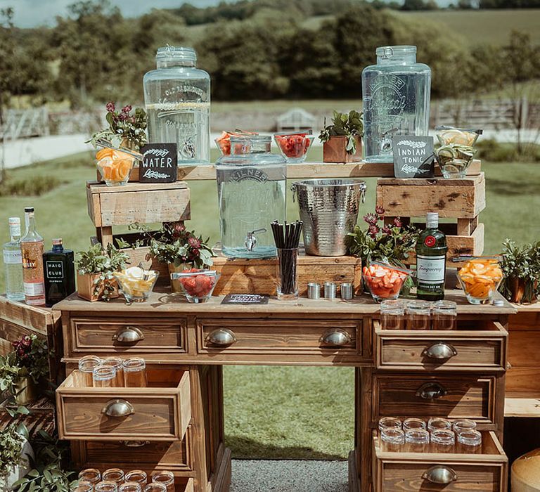 Hydration station with alcoholic and non-alcoholic drinks outside at Farbridge wedding venue 