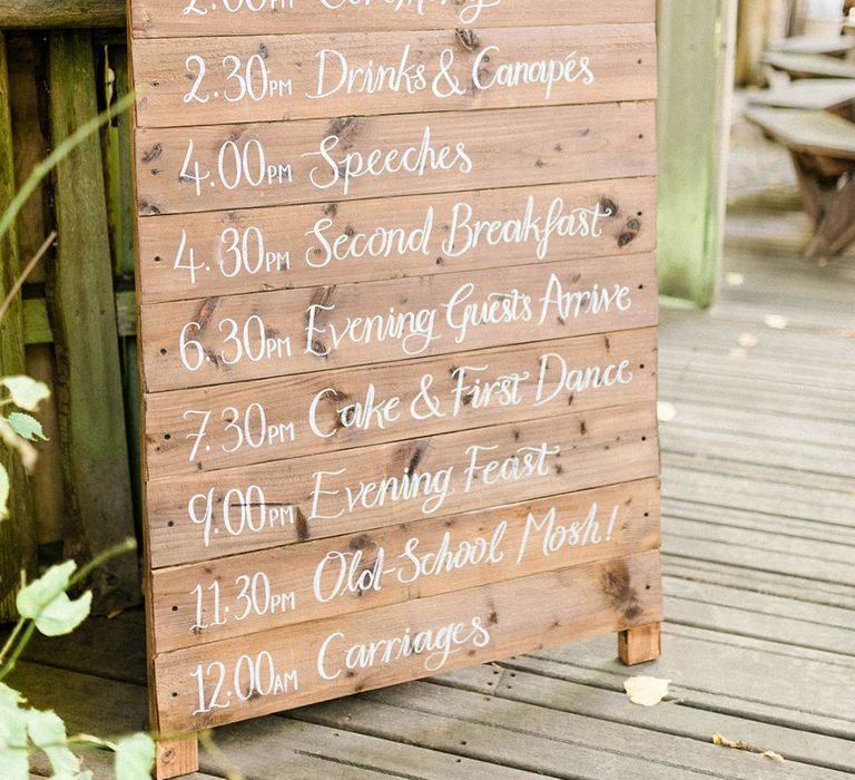 Wooden board wedding signage with white writing 