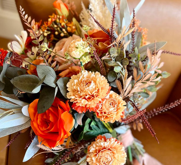 Dark orange rose wedding bouquet with dried flowers for fall wedding 