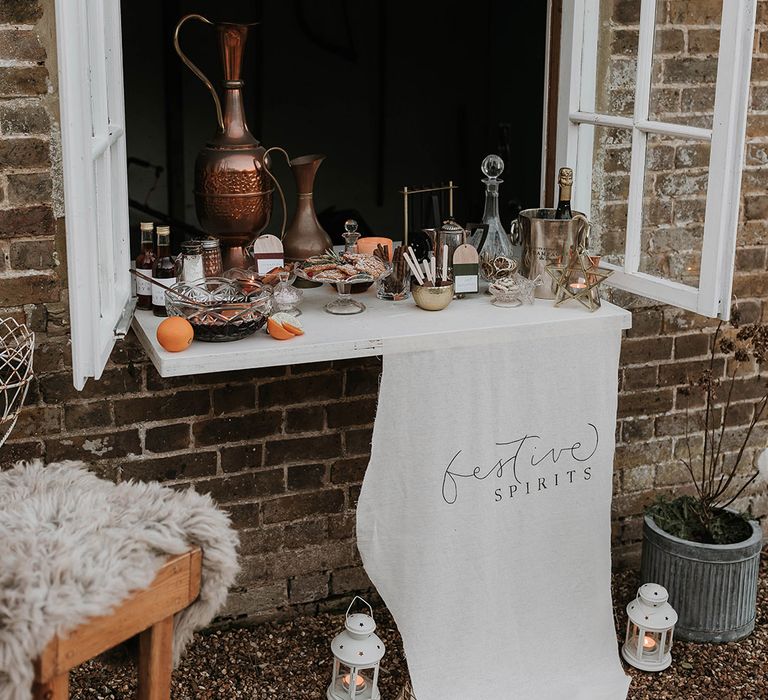 Winter wedding drinks station with hot chocolate and mulled wine 