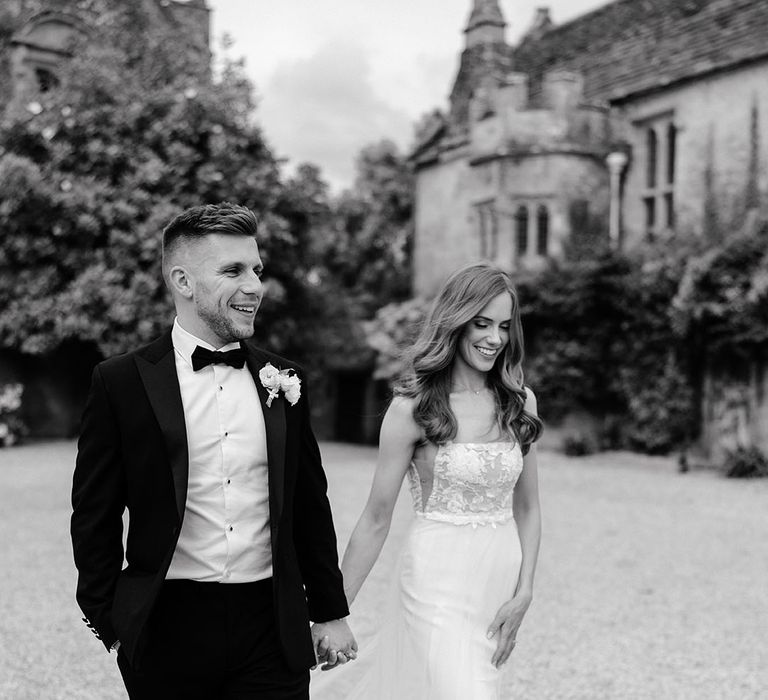 Black and white wedding photography with photo of bride and groom on their wedding day at Brympton House 