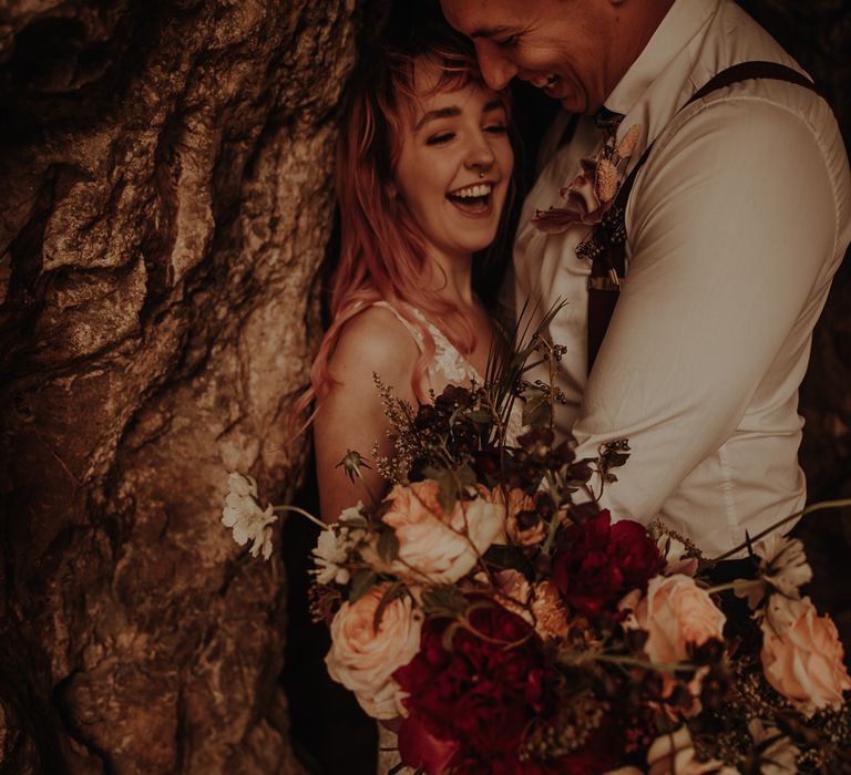 Bride and groom laughing at beach cove wedding photography