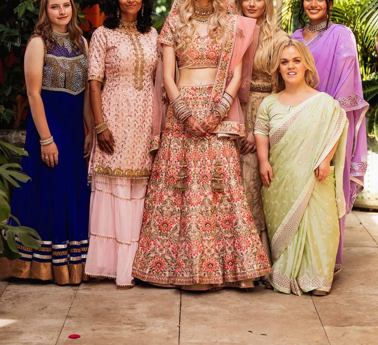 Bride in Pink Sari with her bridesmaids 