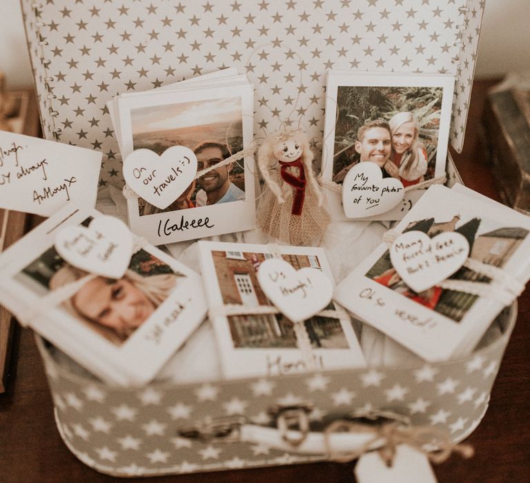 vintage suitcase filled with polaroid pictures 