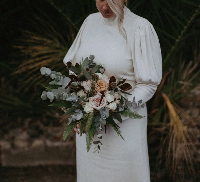 Bride in a vintage inspired bridal gown and wedding headband 